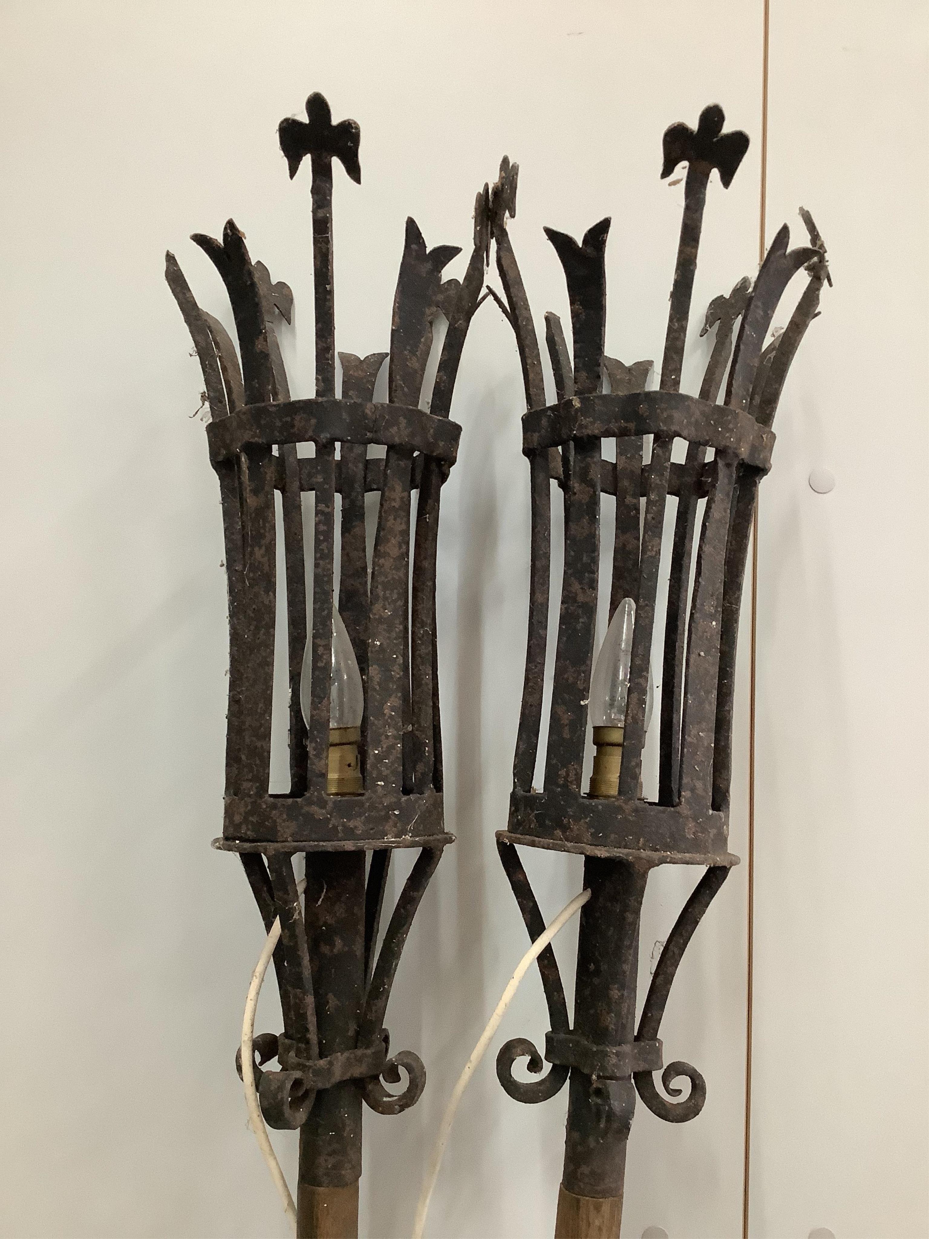 A pair of gondola style wrought iron and oak lanterns, height 190cm. Condition - fair to good